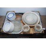 A box of kitchen glassware, mixing bowls and kilner jars.