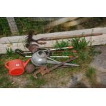 A quantity of watering cans, stilsons, ladle, tools, etc.