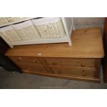 A pine four drawer lowboy, 54" x 22" x 18" deep.