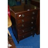 A flight of five drawer, chest of drawers.