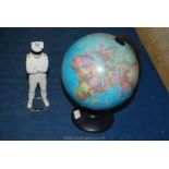 A small globe and a stig figure.