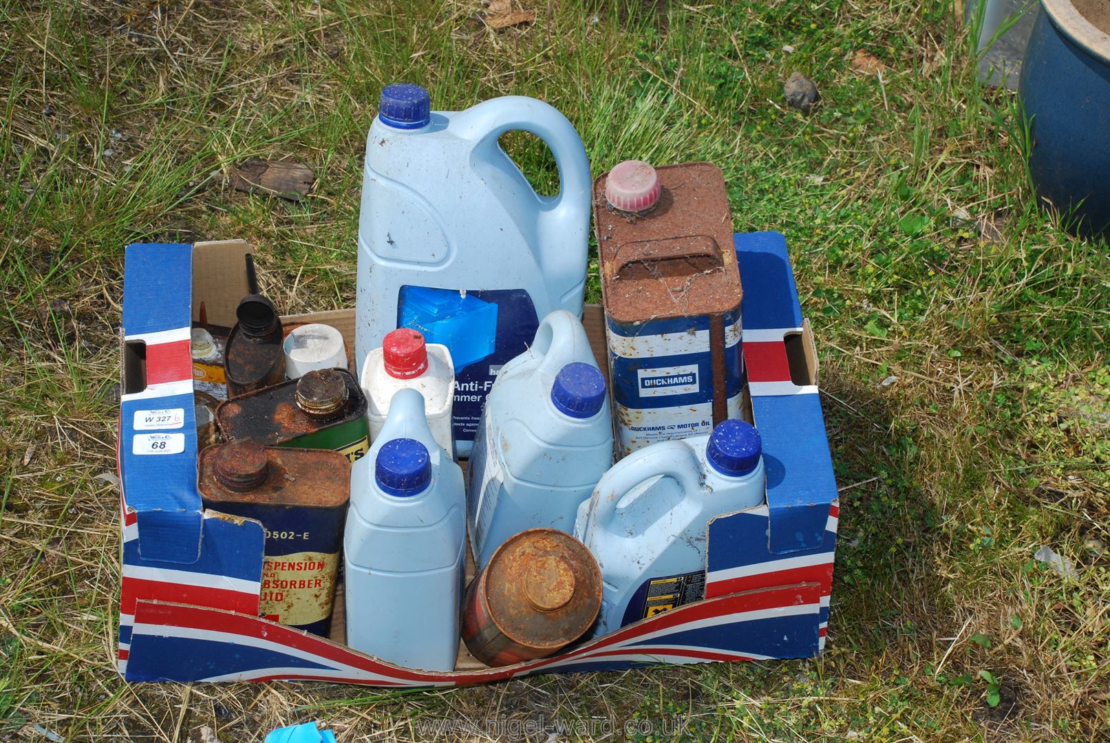 A box of motor oil and motoring fluids, etc.