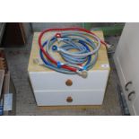 A bedside chest of drawers and a quantity of washing machine and dishwasher hoses etc.