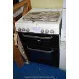 A gas top electric oven.
