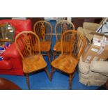 Four wheelback kitchen chairs.