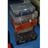 A quantity of vintage suitcases.