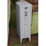 A ten drawer Stationery Cabinet, 40'' tall x 11'' wide x 16'' deep.