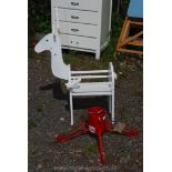 A reindeer wooden planter and a Christmas tree stand.