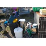 A quantity of dust bins, motor oils, umbrella, etc.