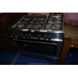 A Kenwood stainless steel and glass Range cooker, believed mains gas hobs and electric fan oven.