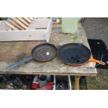 A Le Creuset frying pan and another.