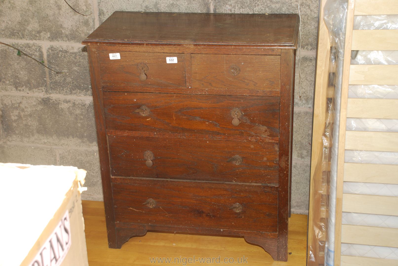 A two over three chest of drawers.