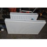 A double convector radiator and a single convector radiator.