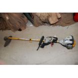 A Ryobi soft touch petrol Strimmer.