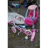 A girl's pink car, bike and scooter.