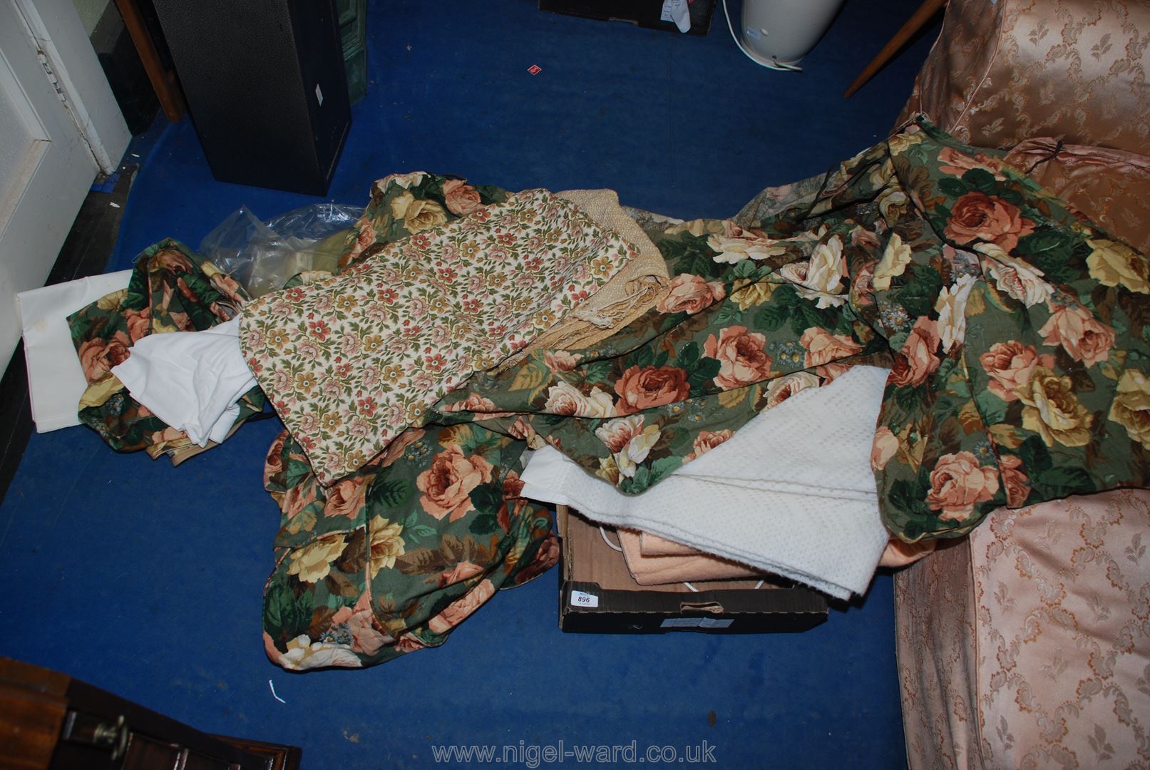 A wool blanket and a quantity of floral printed covers etc.