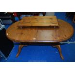 A domed and extending kitchen table, 77" overall x 36" wide x 28" high.