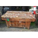 A 1950's Carpenter's workbench with vice and cupboards to either end and sides.