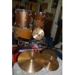 A six piece drum set with various stands, sticks etc.