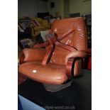 A stylish bent-wood and brown leather swivel chair.