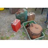 A metal Power petrol can with brass BP can, jerry can, red petrol can and quantity of tins, etc.