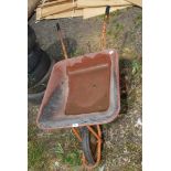 A plastic skip Wheelbarrow with solid tyre.