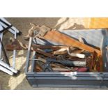 A box of saws, hammers, trowels etc.