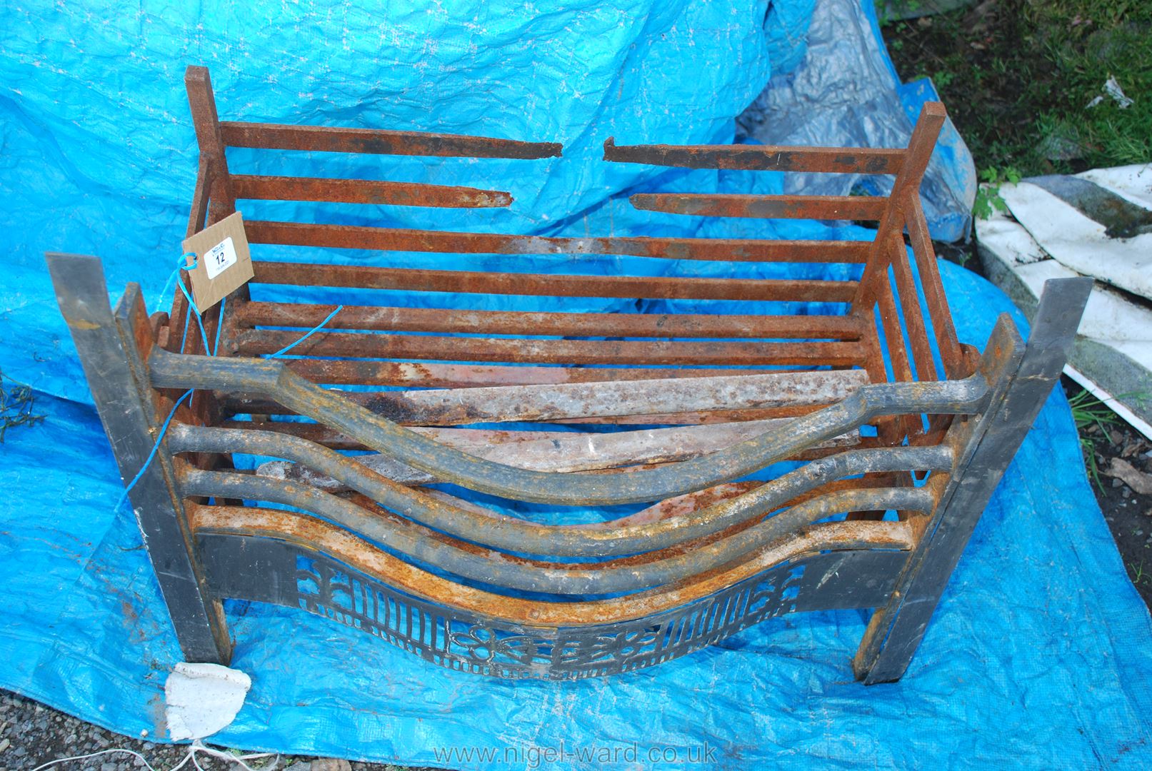 A cast fire basket, 26'' long x 13 1/2'' wide,