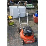 A Flymo self drive mower with Briggs & Stratton engine. Quantum XTE45 petrol engine.