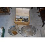 A bread bin containing various cutlery and plated trays etc.