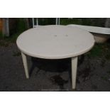 A circular 53'' cream Patio table .