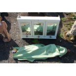 A three section bathroom cabinet and parasol top.