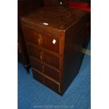 A four drawer chest of drawers.