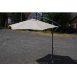 A hand cranked Parasol with base.