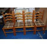 Four ladderback kitchen chairs.