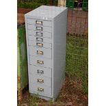 A ten drawer Stationery Cabinet, 37'' high x 11'' wide x 16'' deep.