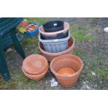 Terracotta and various plastic planters.