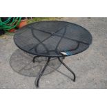 A 41'' metal pierced patio table.