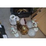 A quantity of ceiling and wall lights and table lamps.