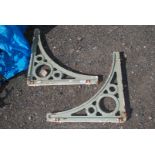 A pair of cast iron brackets,