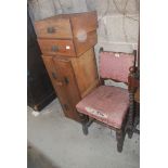 A dining table and four cupboard drawers.