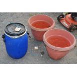 Two large plastic planters and a small drum with lid.