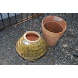 A terracotta Pot and a honey pot shaped Planter.