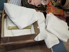 A quantity of cotton bed linen, double sheets, pillowcases, flat sheets etc.