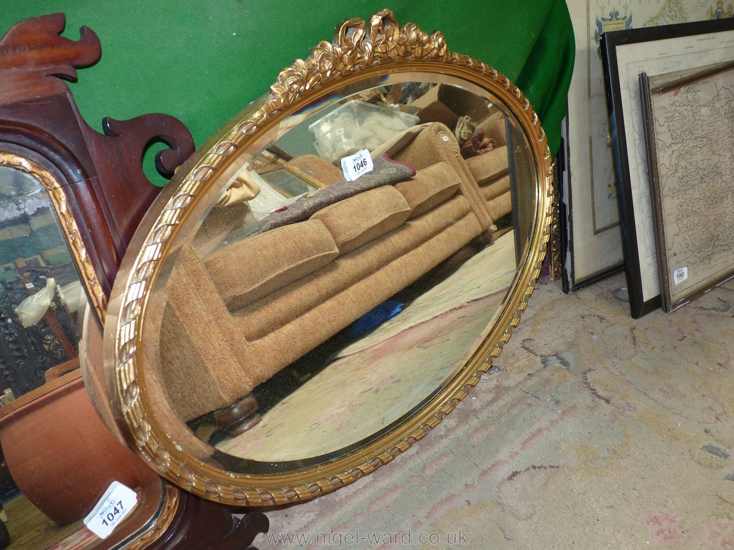 An oval bevel plate wall Mirror with pretty gilt frame, 28'' x 19''.