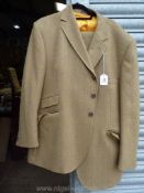 A gent's green/brown tweed Suit by Bladen, with gold lining, size 46''.