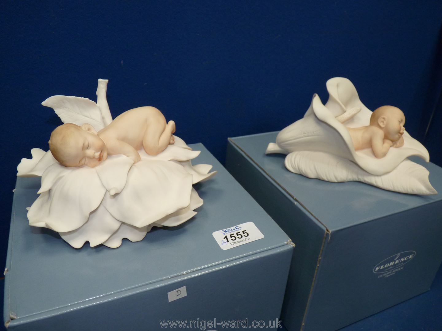 Two boxed Giuseppe Armani figurines of 'Rose boy' and 'Lily baby'.