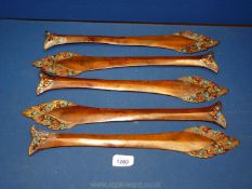 A set of five very unusual Tibetan bronze arrow shaped mounts, circa 1900,