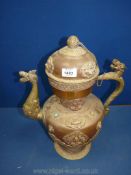 A Tibetan copper and brass ceremonial Dragon ewer with dragon handles and spout,