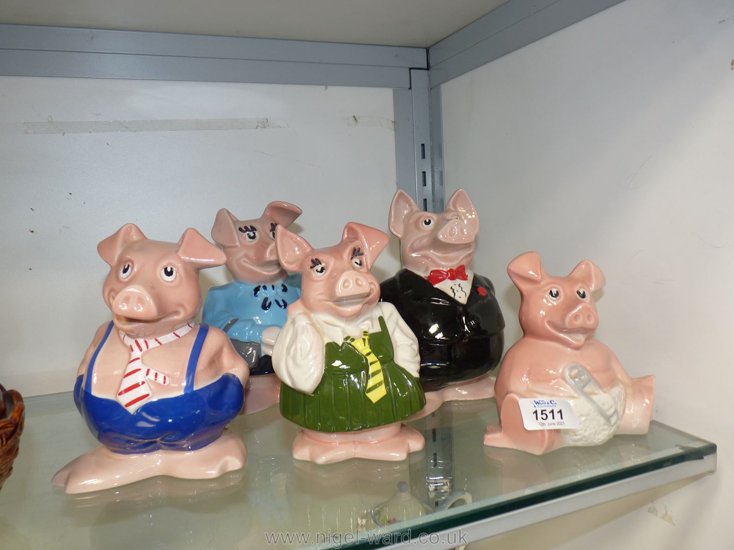 A family of Wade Nat west piggy banks.